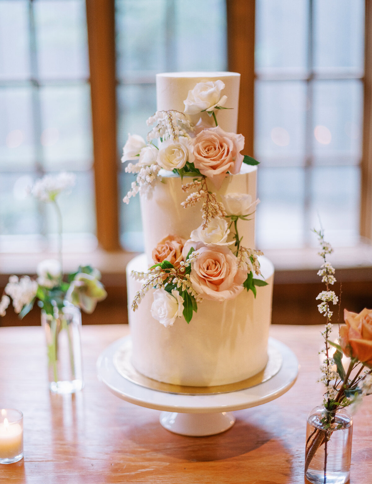 classic white wedding cake with romantic floral