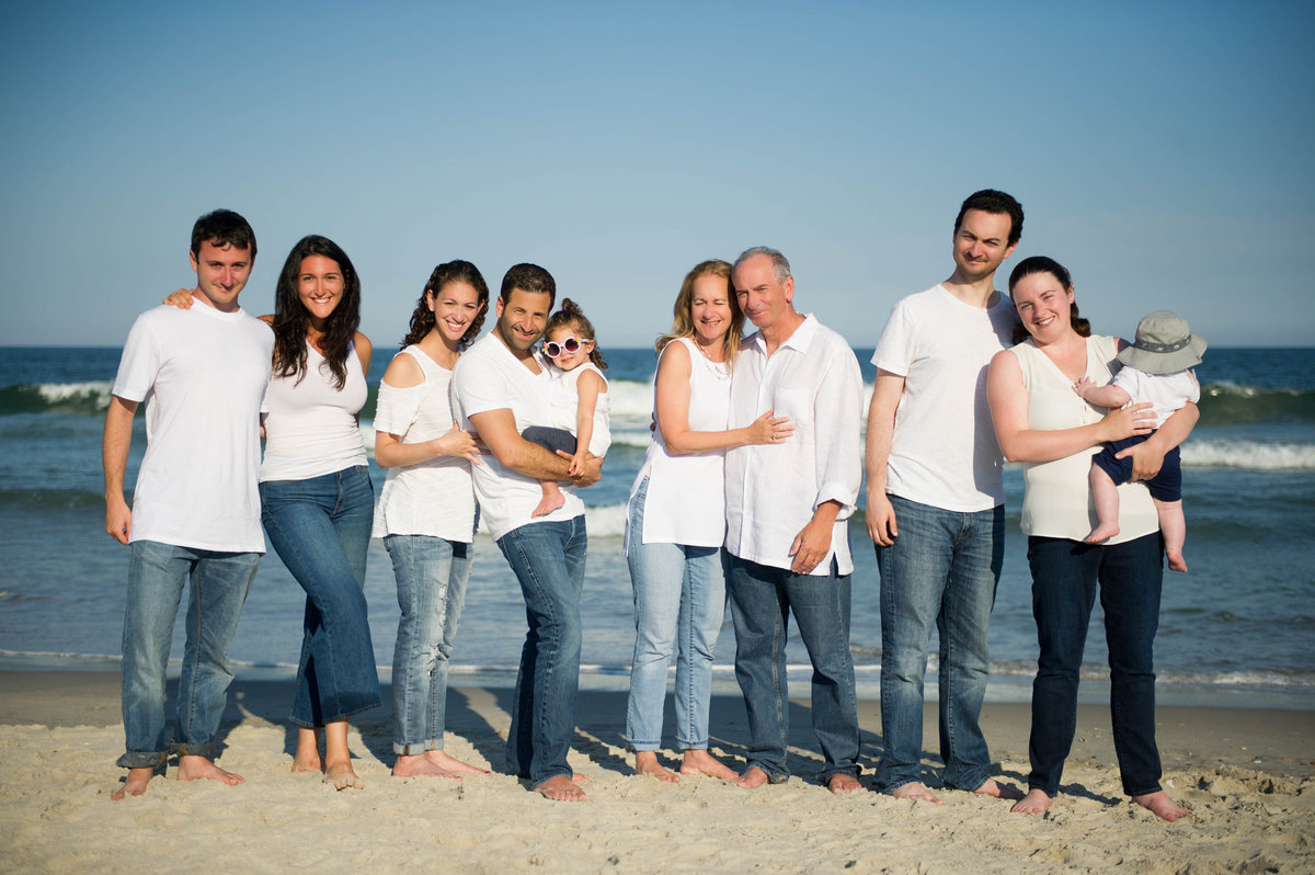 family wearing white shirts for beach photos