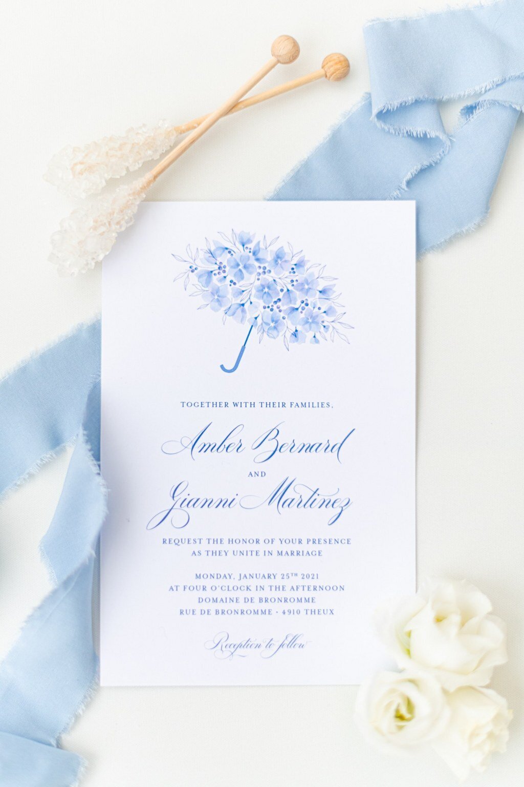 dusty blue wedding invitation with watercolor florals