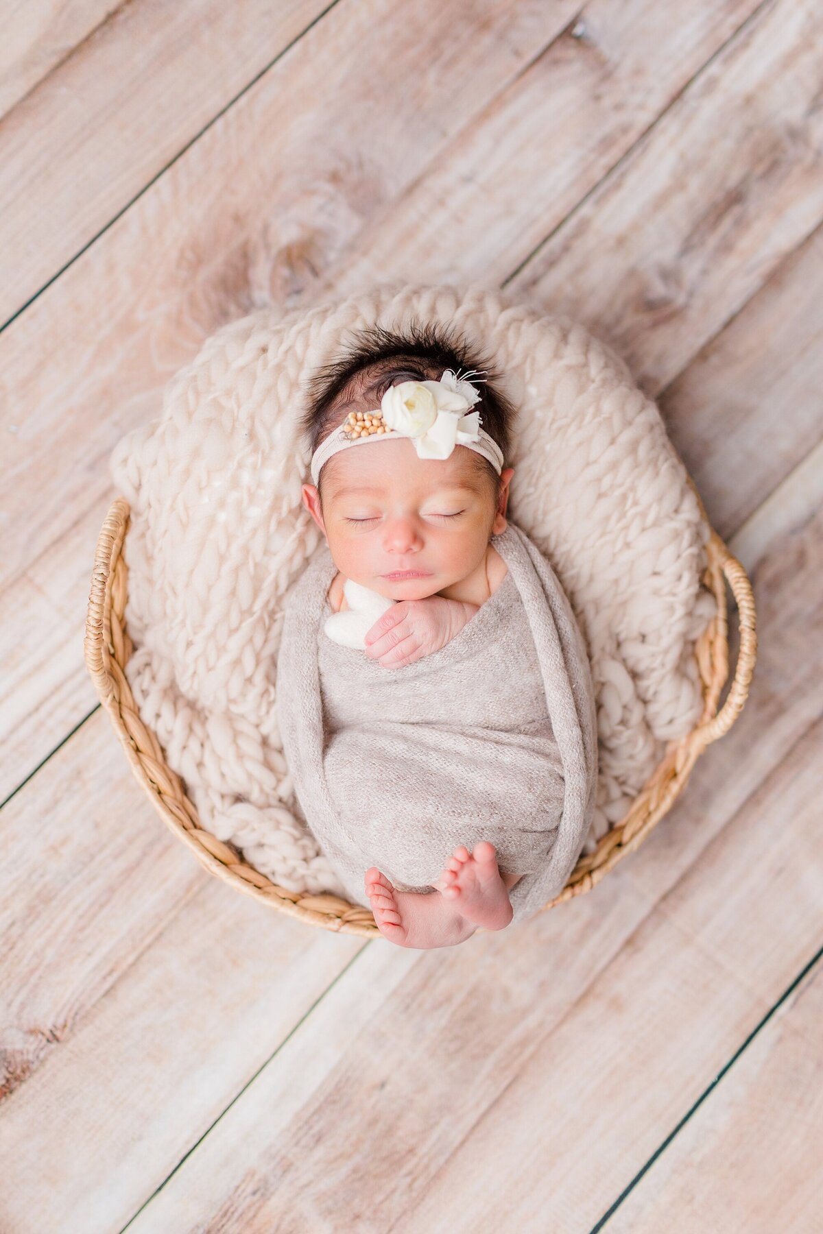neutral newborn girl in basket