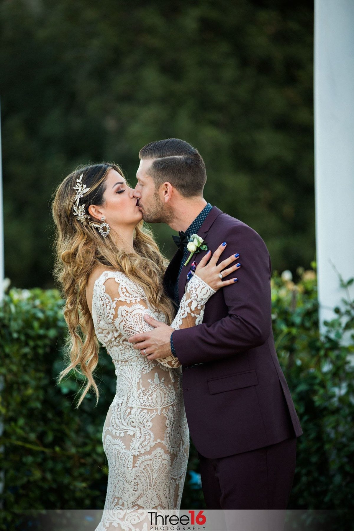 Bride and Groom share a kiss during photo session