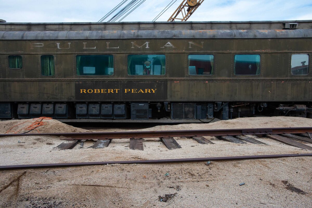 Old Pullman Train Car with crane and rain-deer in window