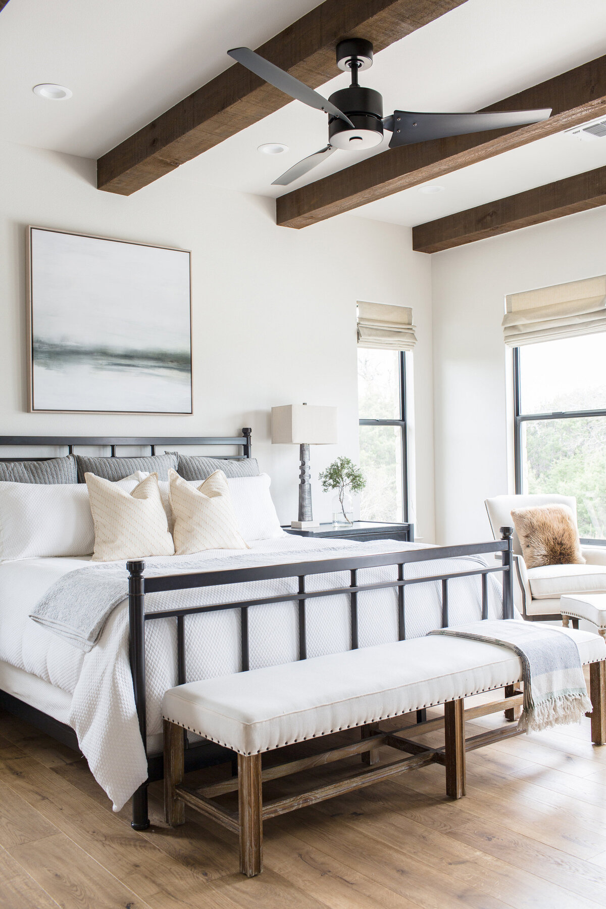 modern ranch style bedroom with wood beams on ceiling
