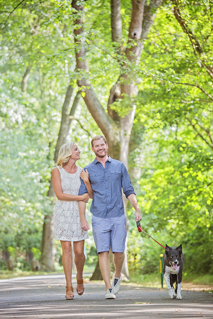 Charlotte wedding photographer Jamie Lucido, fun engagement session at a park during spring, with happy couple and dog