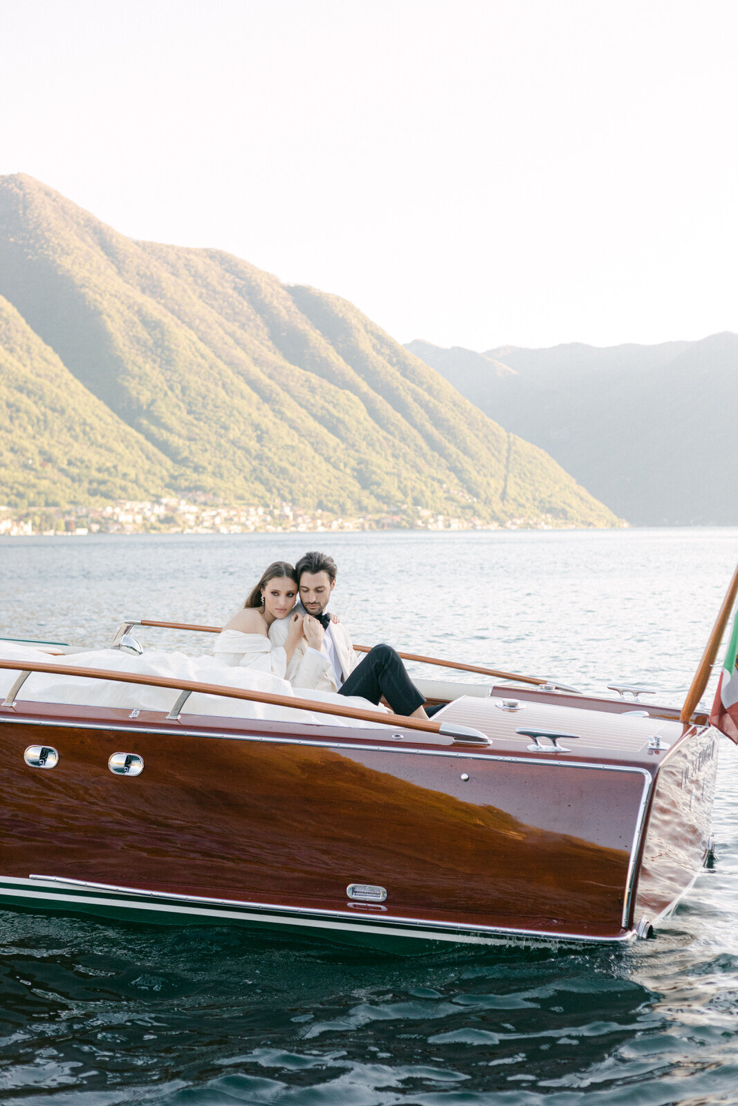 wedding couple boat ride on a wooden Cadenazzi in Lake Como