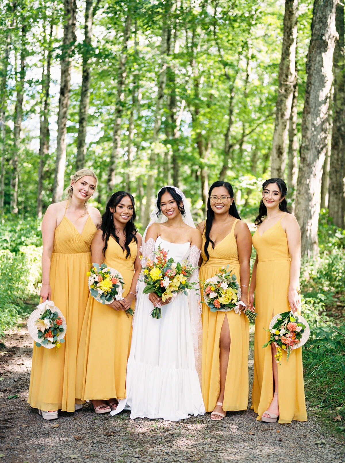 Bride with bridesmaids wearing yellow dresses at  Woodburn Ridge Wedding, Nova Scotia