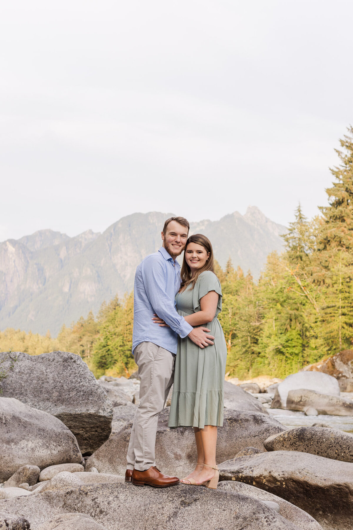 PNW mountain engagement session on highway 2 Stevens Pass with Snohomish river and Cascades colorful photo by Joanna Monger Photography