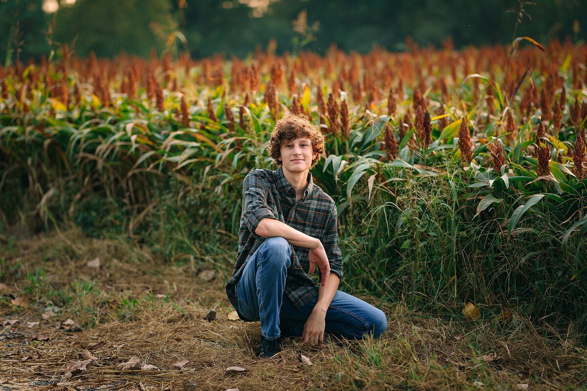 Senior boy photography in front of a field