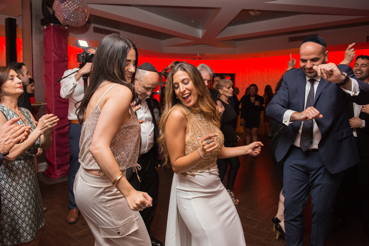 bride dancing with guests at wedding reception at Sephardic Temple