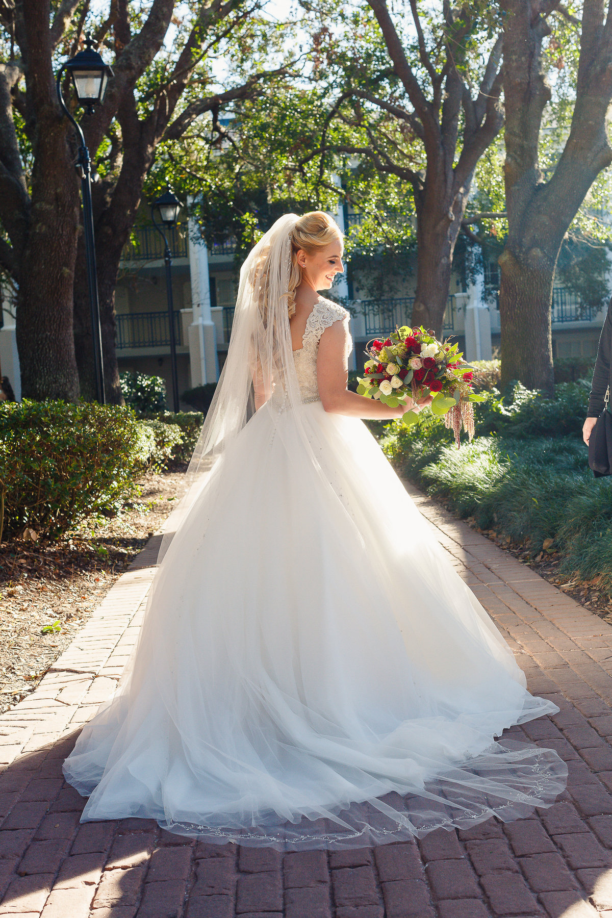 A Bride at a Disney Port Orleans Wedding Looks Back Over Her Shoulder