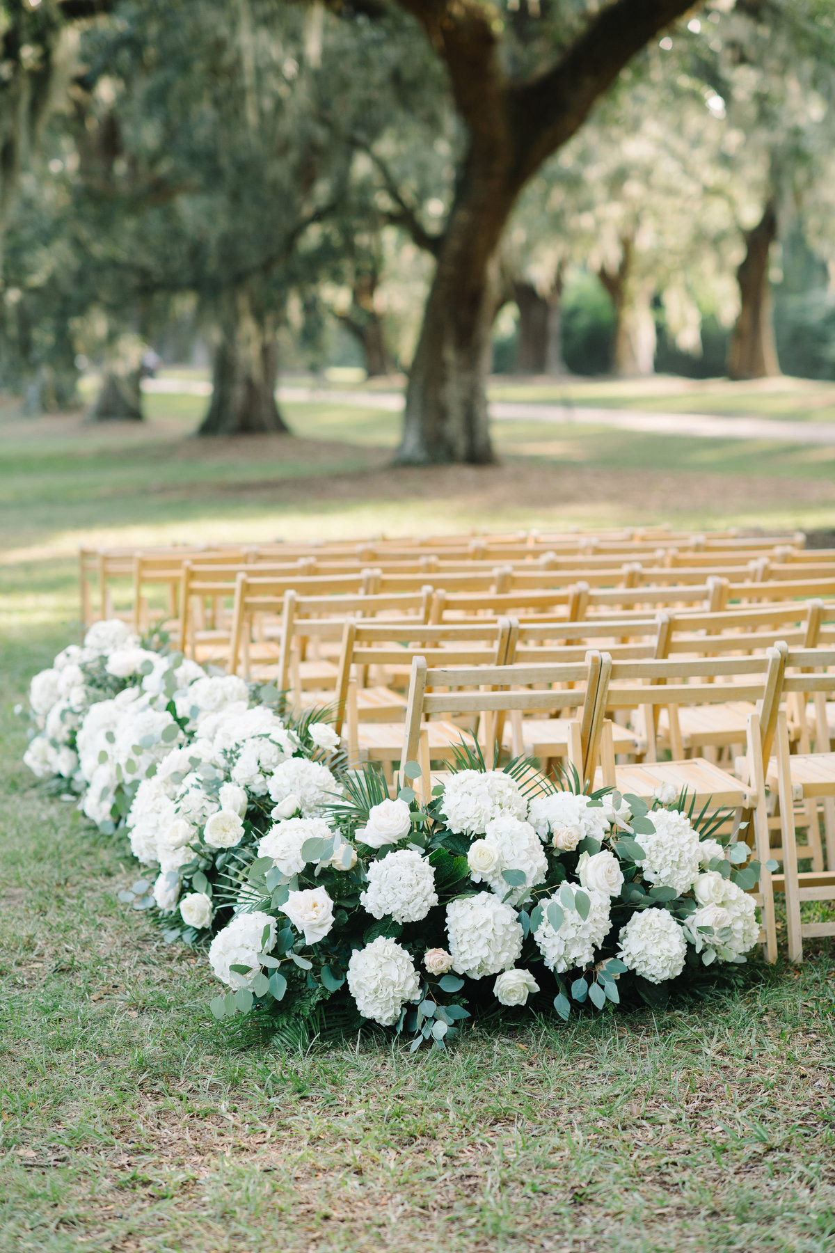 Wedding Ceremony Floral Lined Aisle with White Hydrangeas and Greenery
