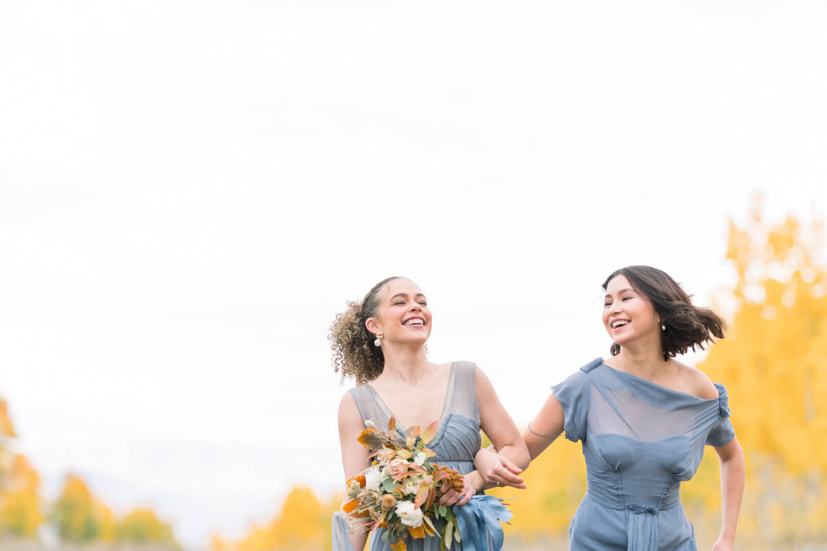 Fall-Wedding-Bridesmaids-laughing-in-dusty-blue-dress-by-Beyond-Jade