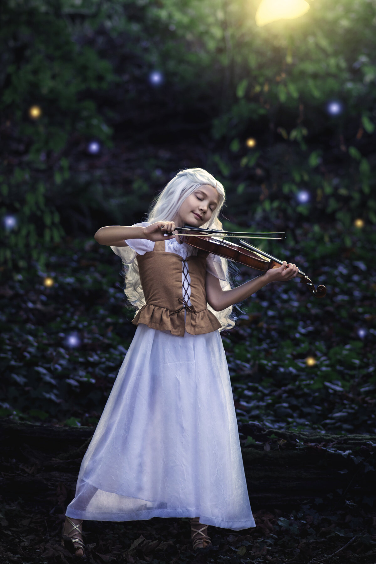 girl plays the violin and dances