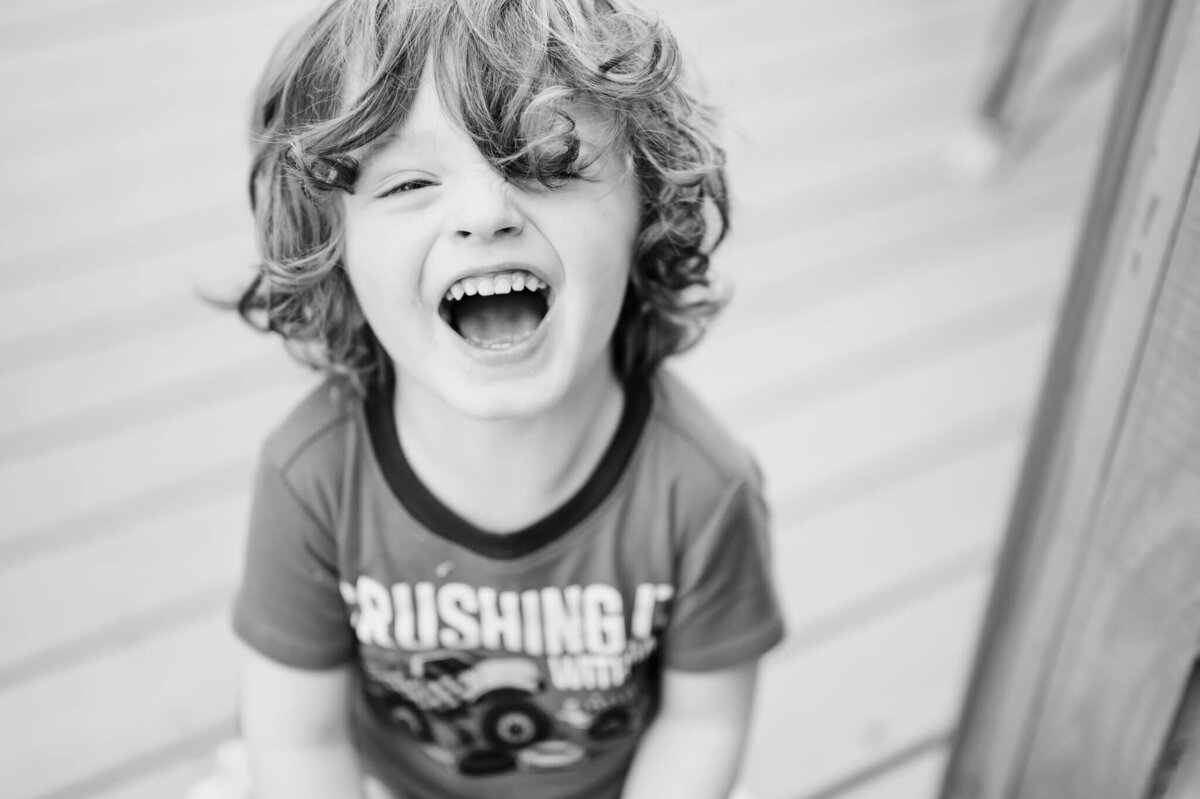 Young Chicago boy with sensory processing disorder laughing.