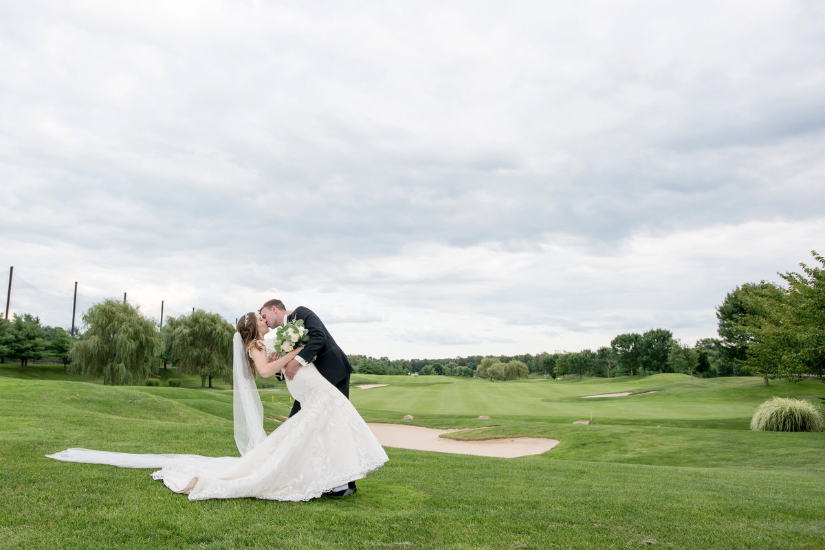 bride and groom on golf course photo Willow Creek Golf and Country Club wedding
