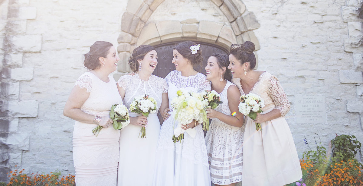 Neutral tone bridesmaids and sisters at Marquette University Milwaukee Wisconsin wedding