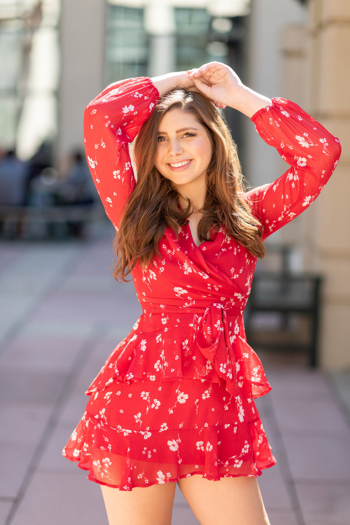 Smiling-woman-in-red-romper-high-school-senior-pictures-ivy-towler-iowa-photography