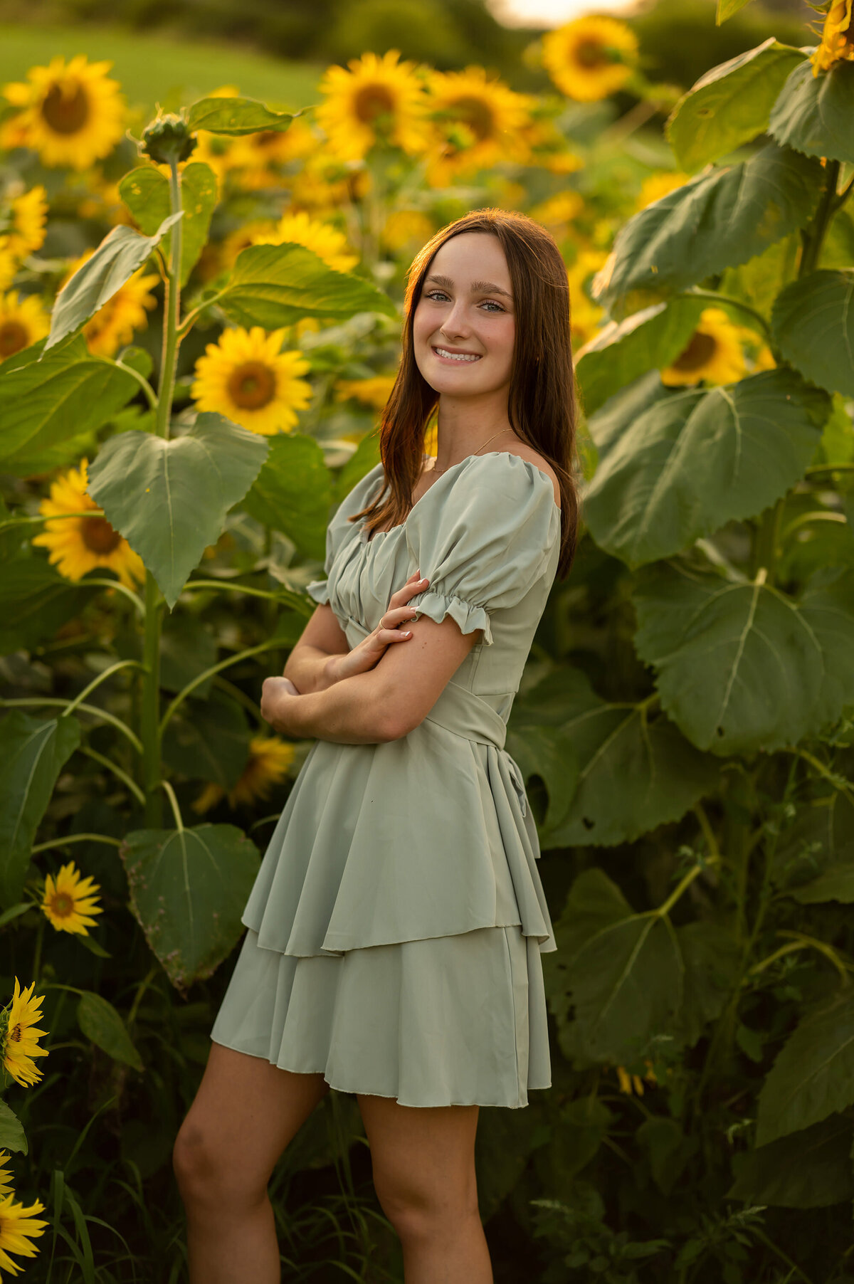 A student from Arrowhead High School has her portrait taken in a field of sunflowers located in Sussex WI.