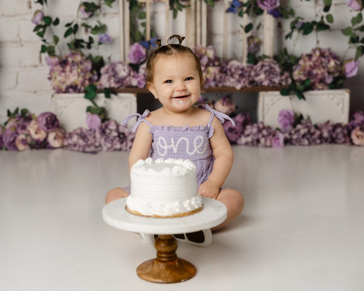 A swirl of purple dreams and sweet frosting kisses! This little one’s cake smash was a beautiful celebration of her first year, captured by Yucaipa cake smash photographer Kaitlyn Dawn Photography.