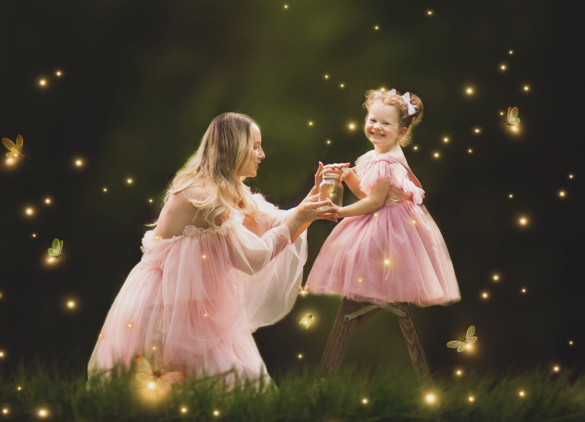 Mother wearing pink dress with daughter during mom and me mini session photoshoot in  Mount Juliet Tennessee
