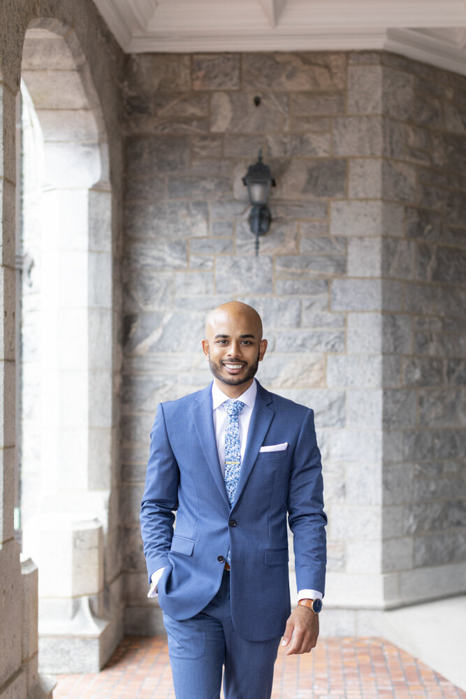 groom poses for a portrait - gold shoes and wedding details - branford house wedding
