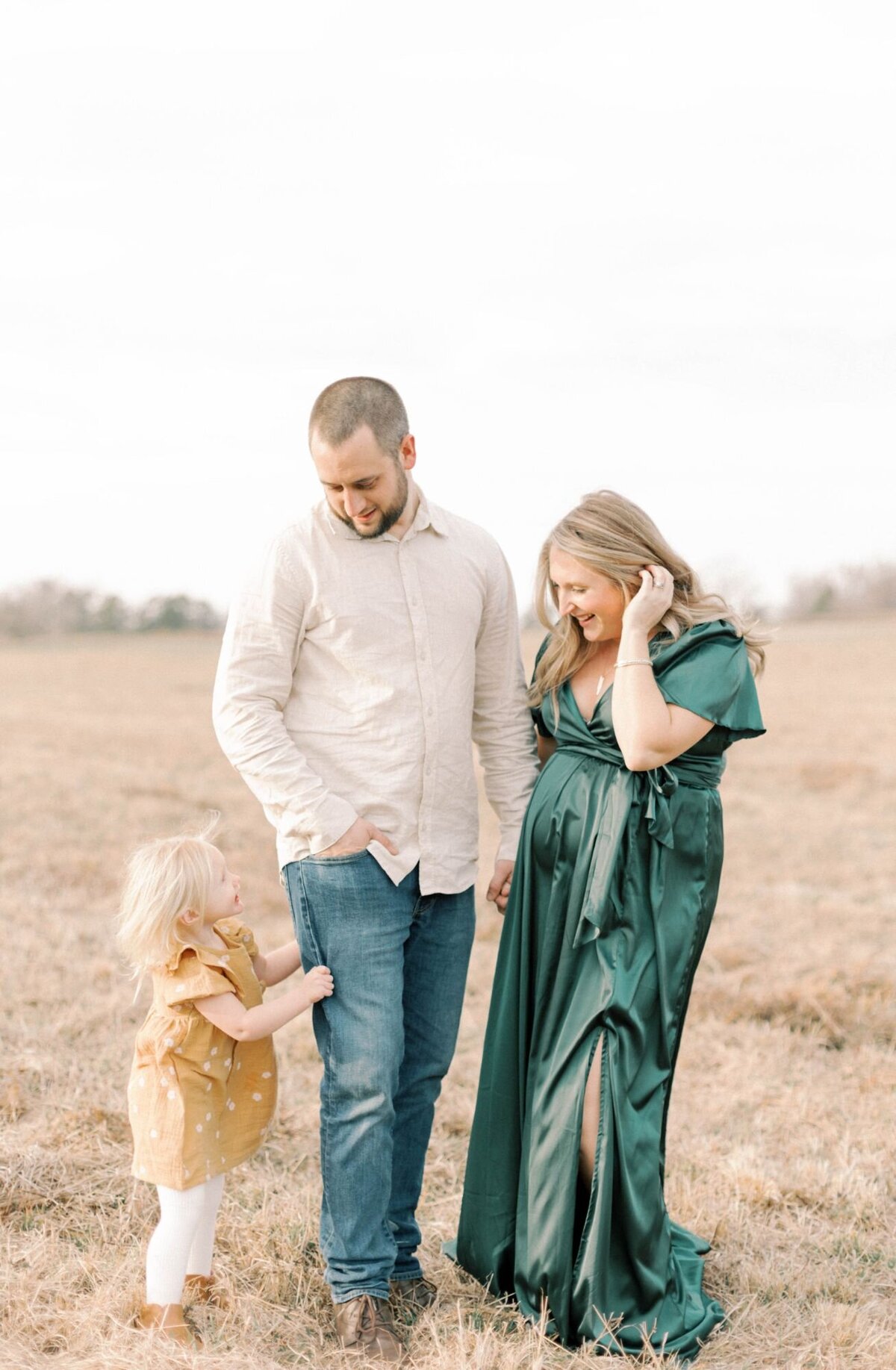 Family talking and playing together with pregnant woman.