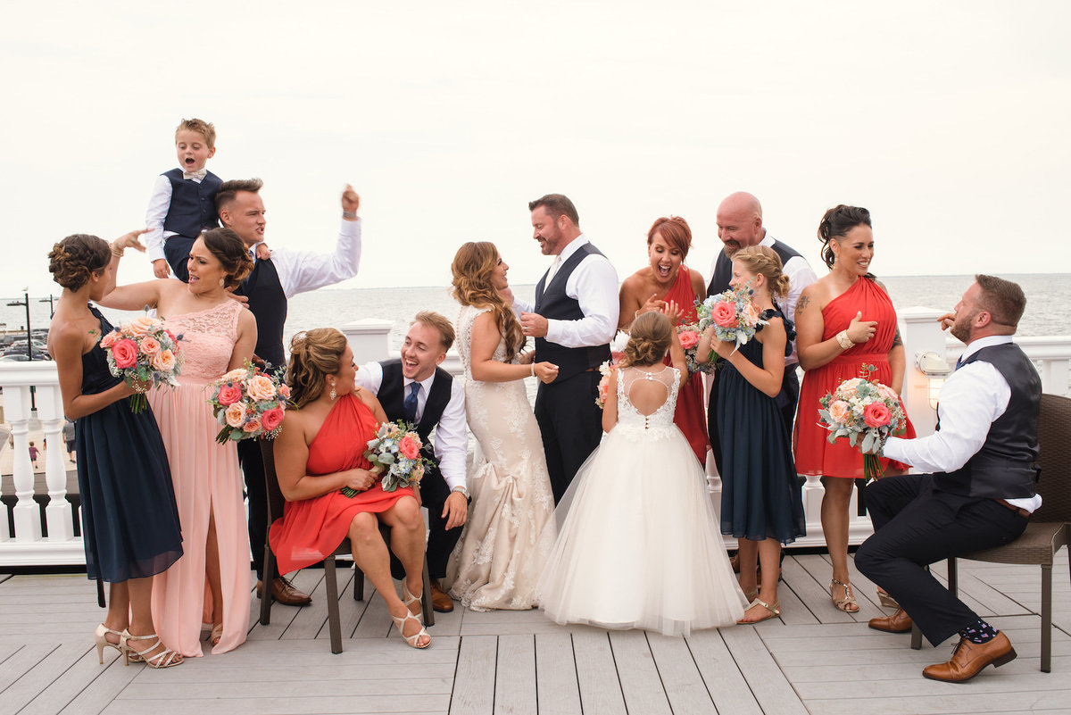 photo of full bridal party on the dock from wedding at Lombardi's on the Bay