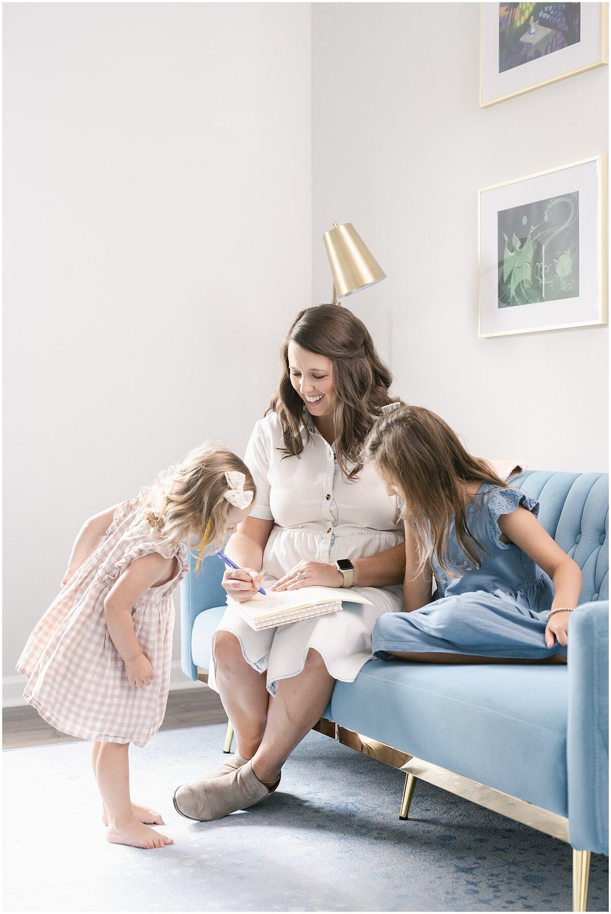 Stationery designer with her children in her home office