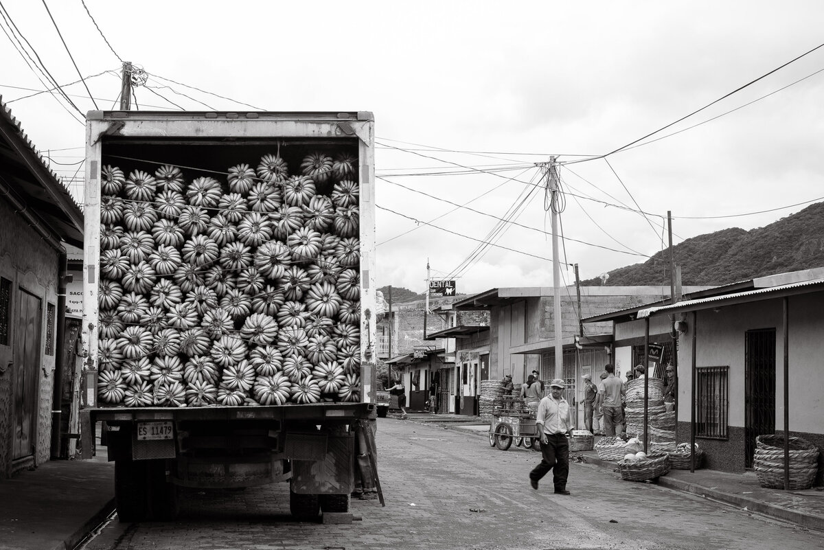 Large truck of bananas filled to the top of container in rural nicraragua