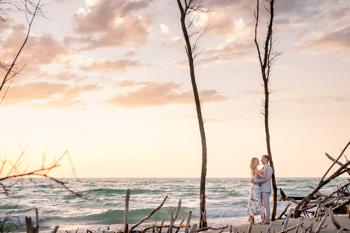 Soon to be married couple share a private moment ont he beaches of Tampa Bay during their engagement session