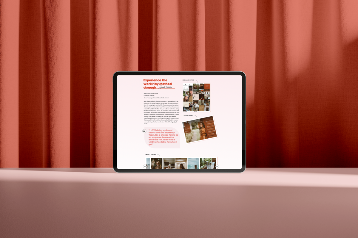 Knoxville web design agency mockup of clean, modern website with pink and red-orange accents on a tablet in front of orange curtains