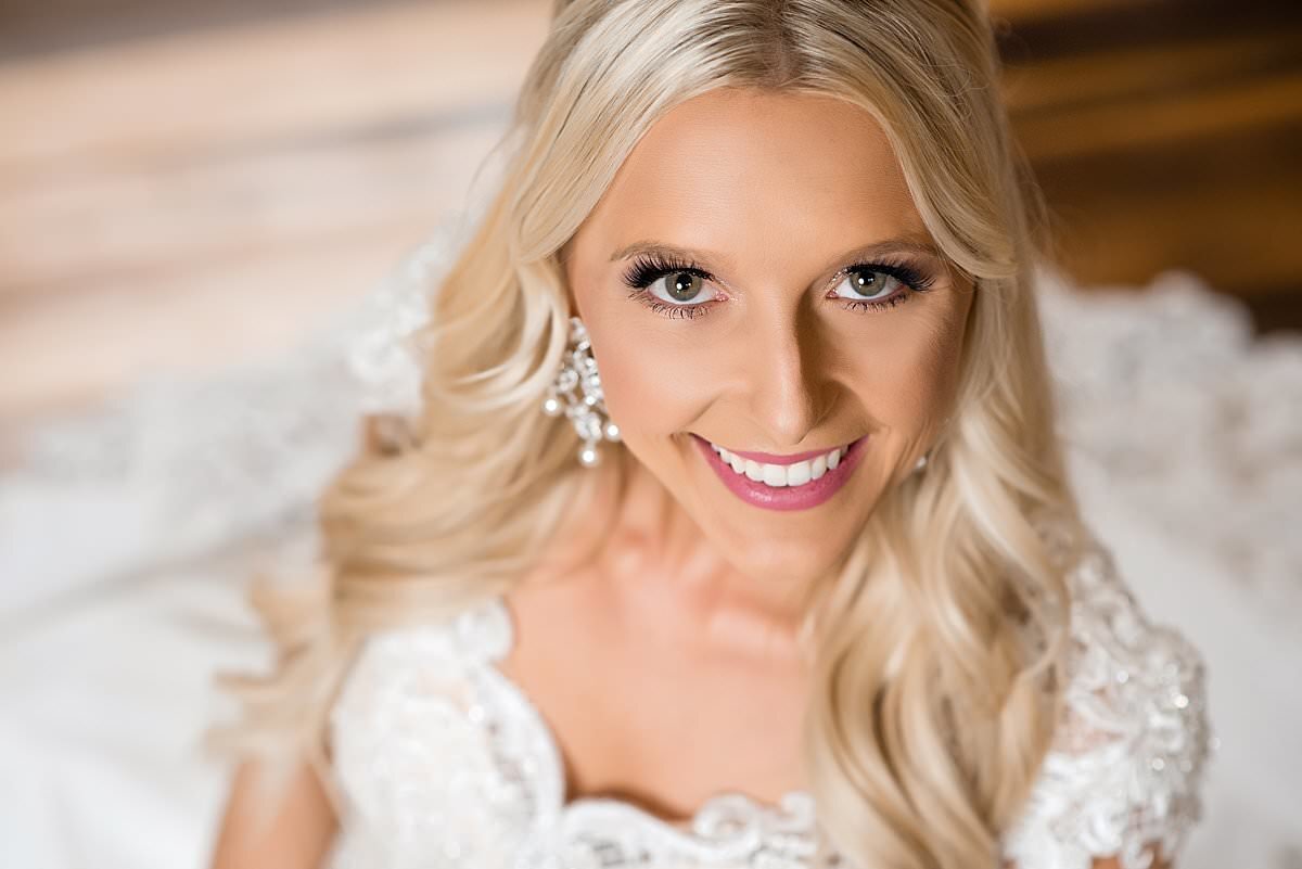 Elegant bridal portrait  of bride smiling at camera