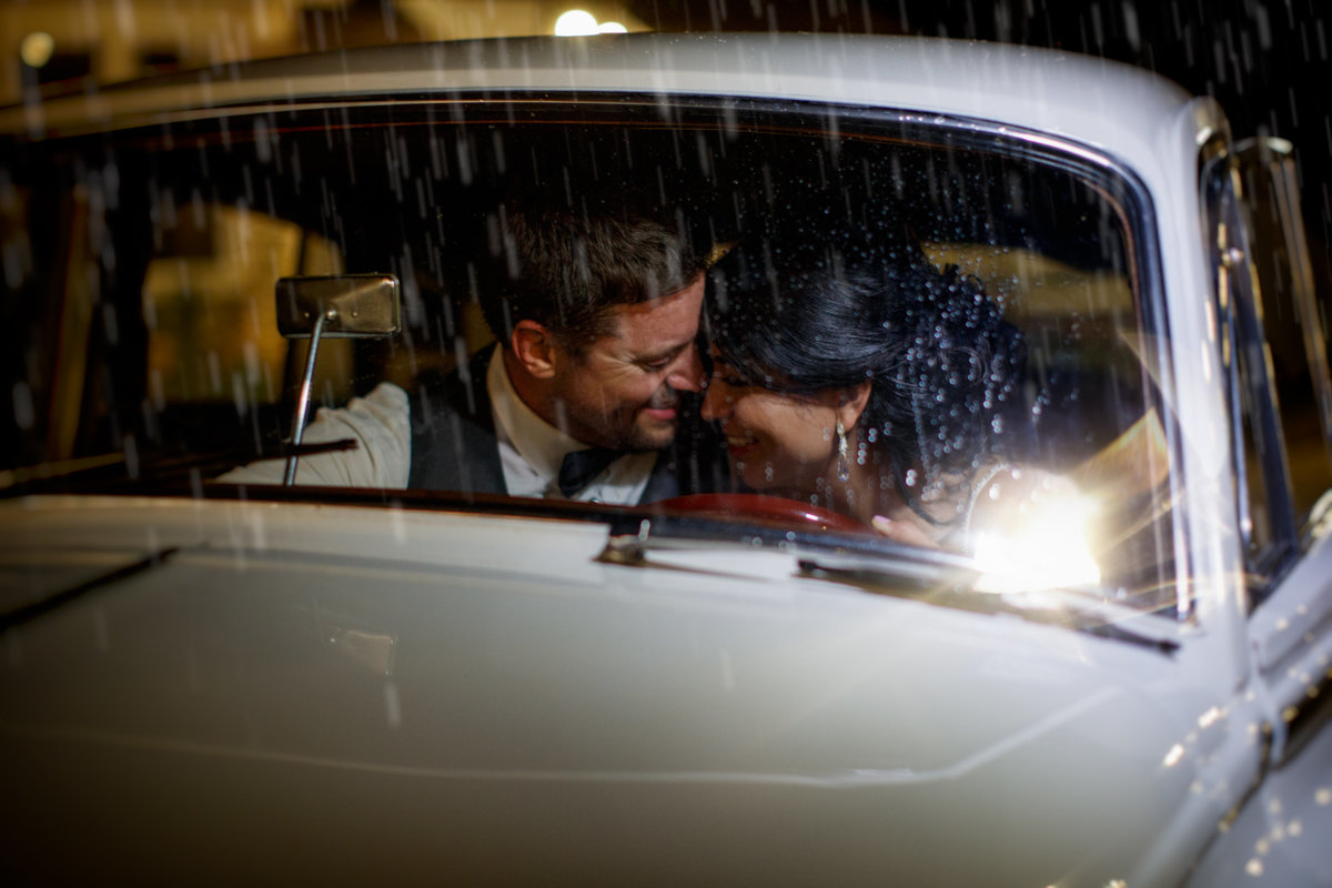Casa Blanca Wedding photographer couple car rain hispanic bride groom family rain 2211 Hairy Man Rd, Round Rock, TX 78681