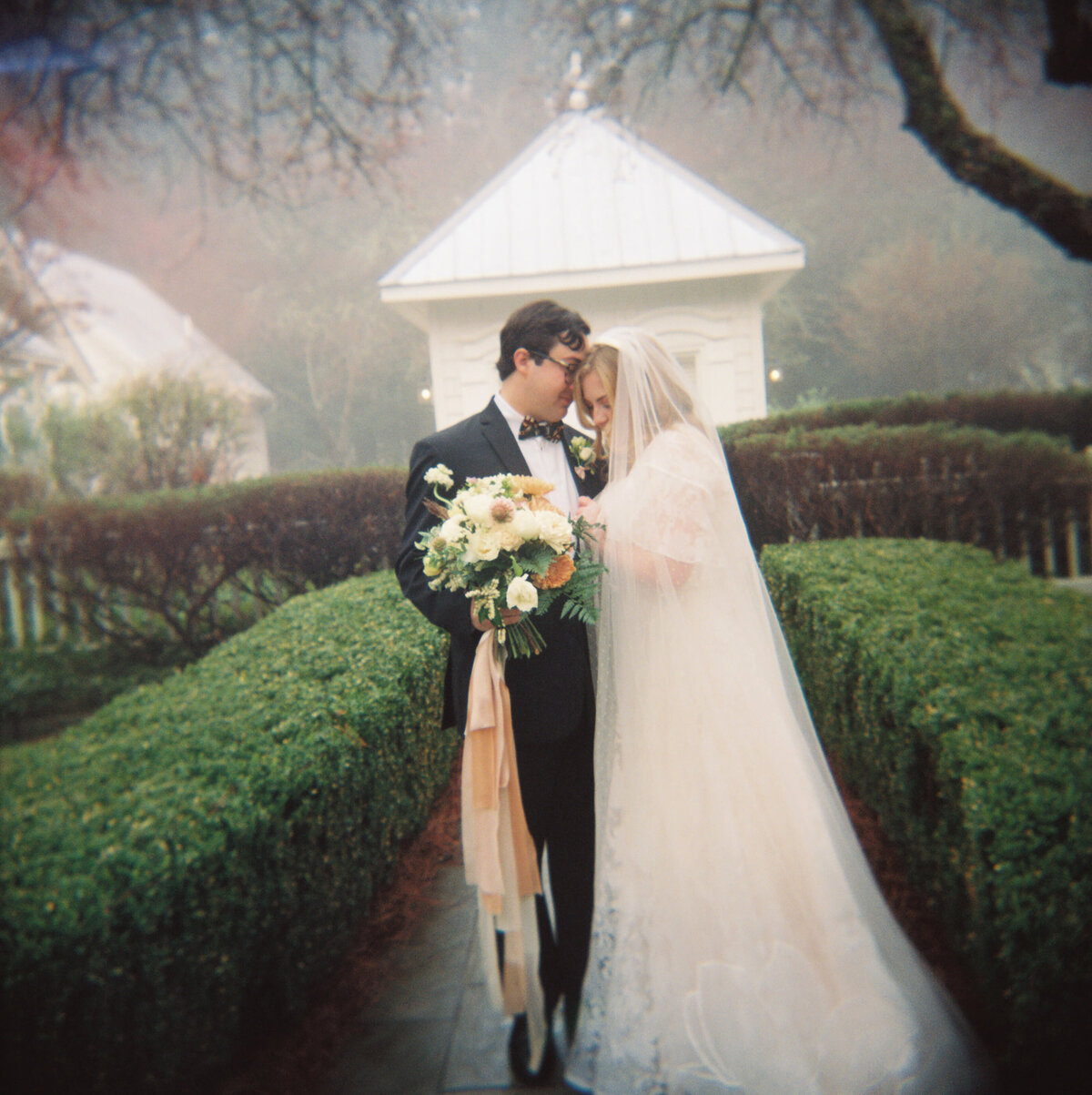 bride-groom-embrace-in-gardens-224