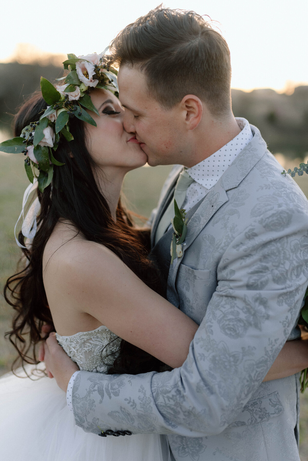 bride and groom kissing during golden hour photos at rosemary ridge
