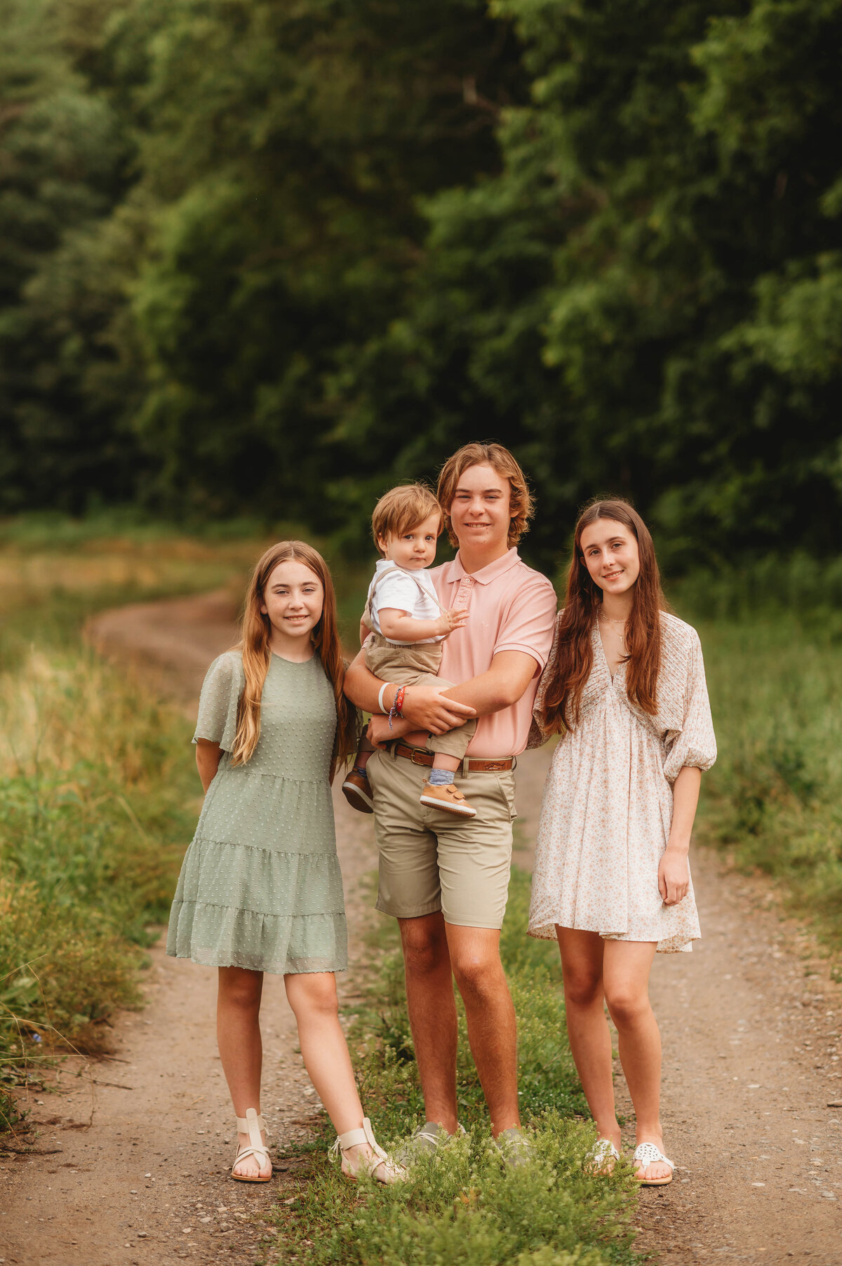 Siblings pose for Portraits during an Extended Family Photoshoot in Asheville, NC.