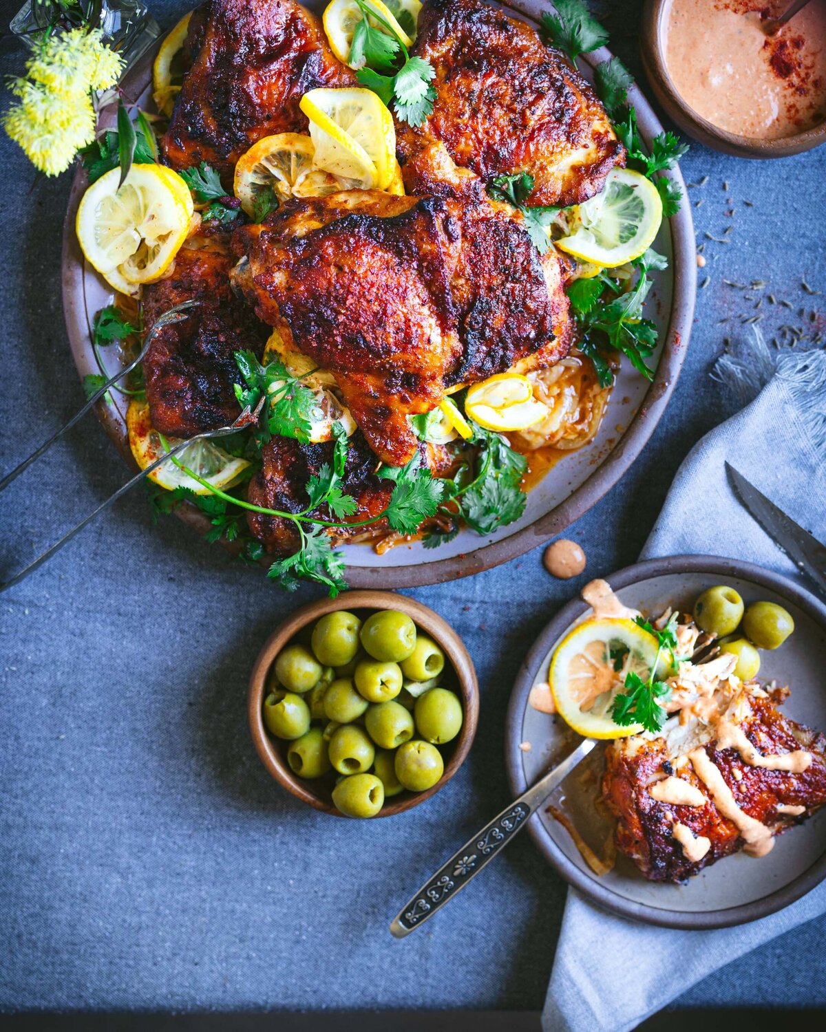 Harissa Chicken served with lemon, olives, cilantro and a spicy aioli