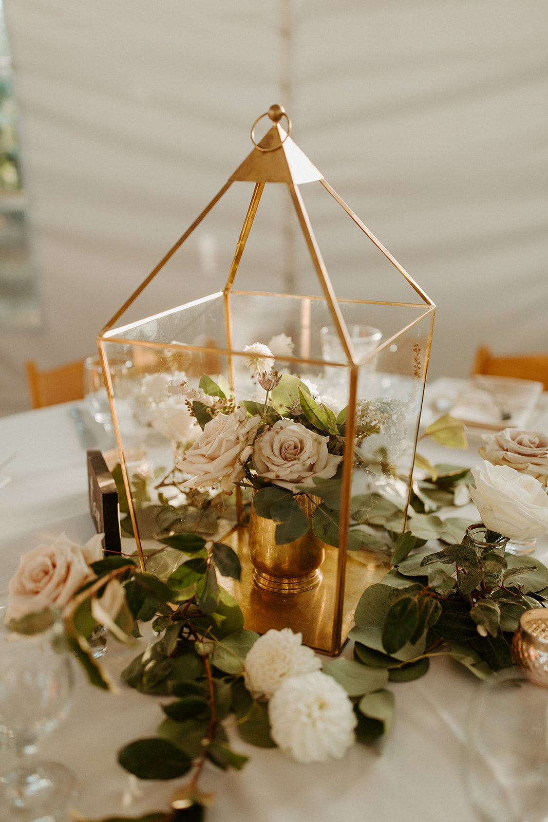 gold lantern with flower arrangement