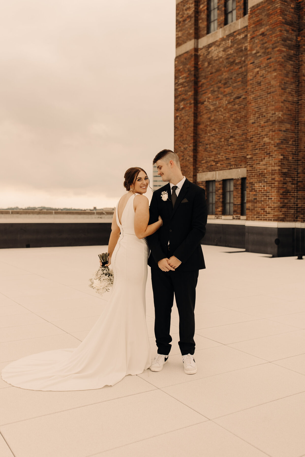 bride and groom portraits on rooftop in iowa
