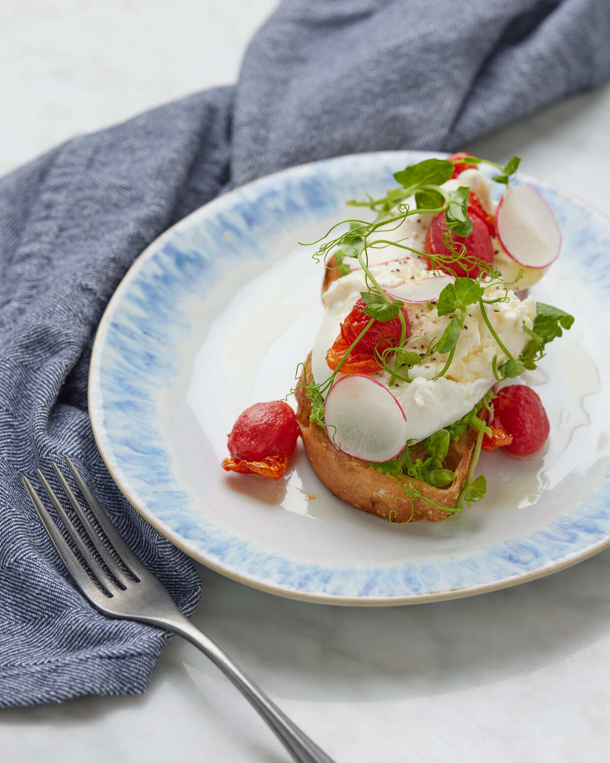 Bread with tomatoes and cheese on it