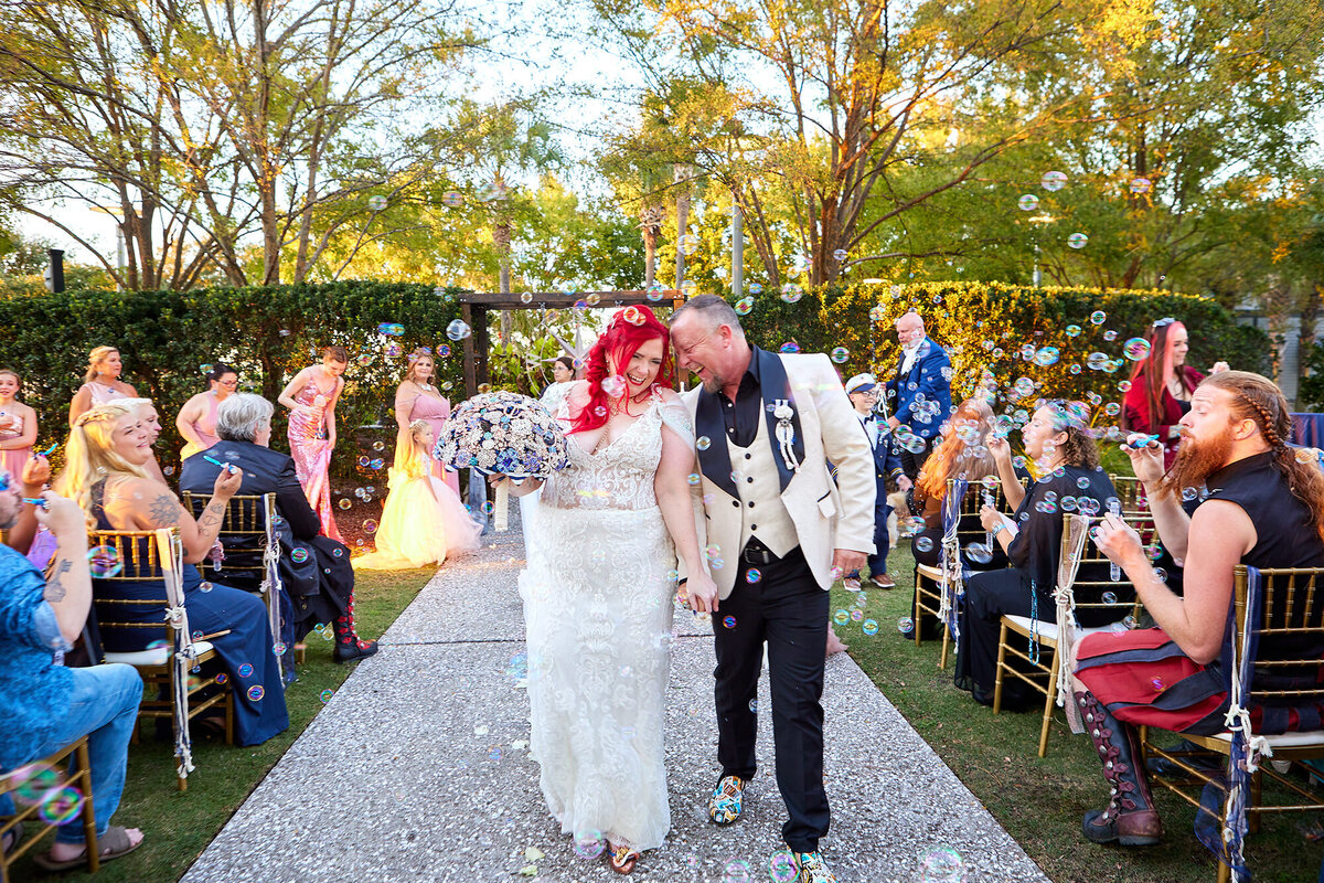 Mount Pleasant Sweetgrass Pavilion wedding recessional with bride and groom, Charleston Wedding Photographer