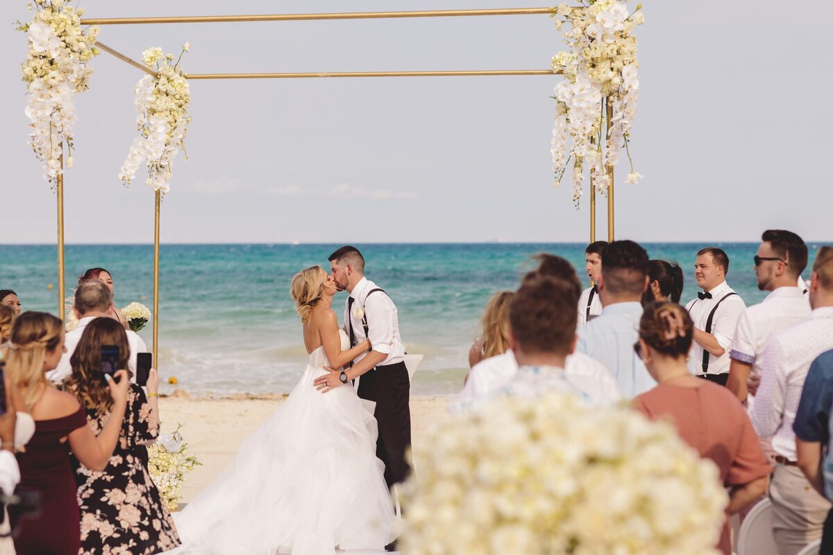 Bride and grooms first kiss at  Iberostar Paraiso Riviera Maya Wedding