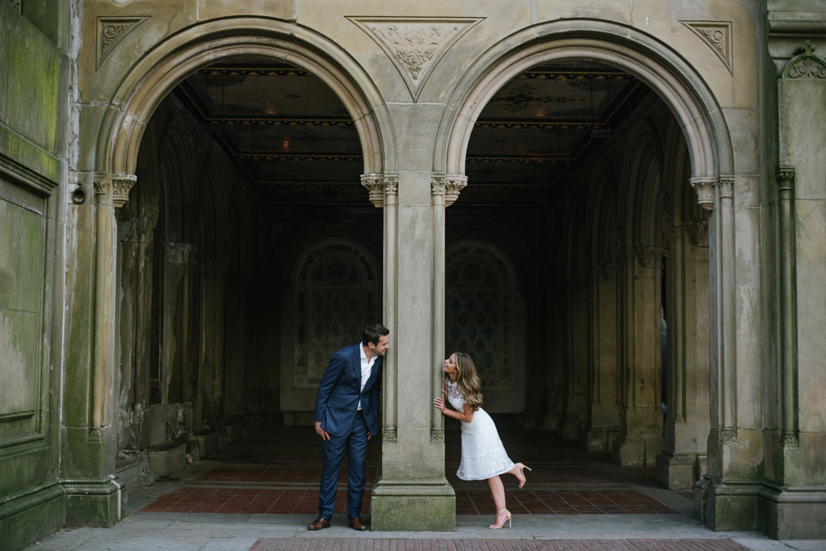 playful engagement photo at bethededa terrace in central Park