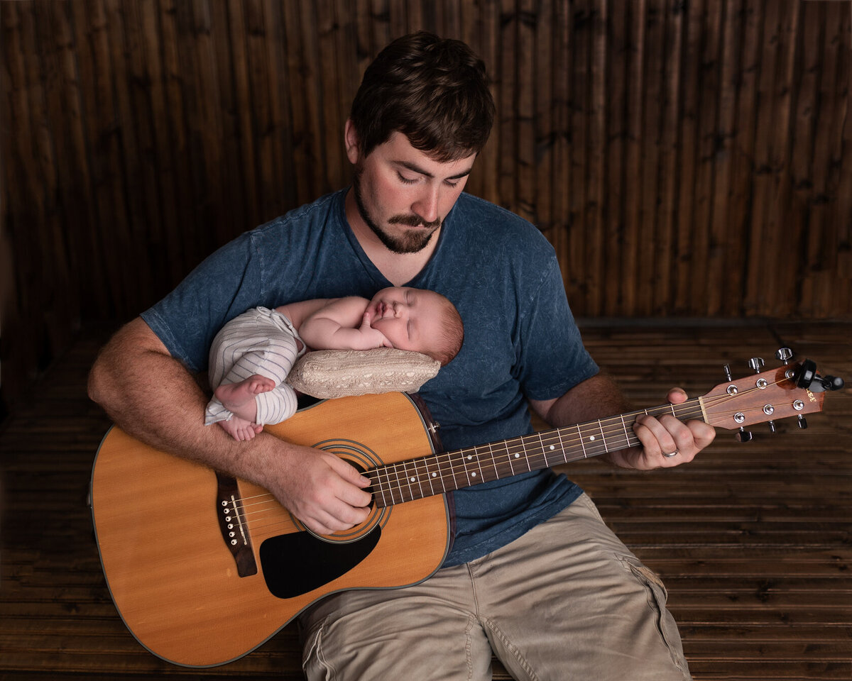 Newborn and Dad in creative guitar photo session in Houston