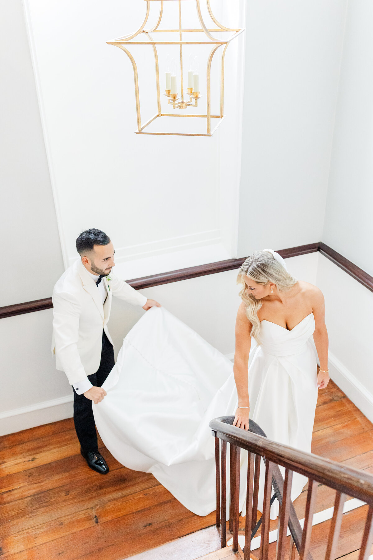 bride and groom on stairs at gadsden house