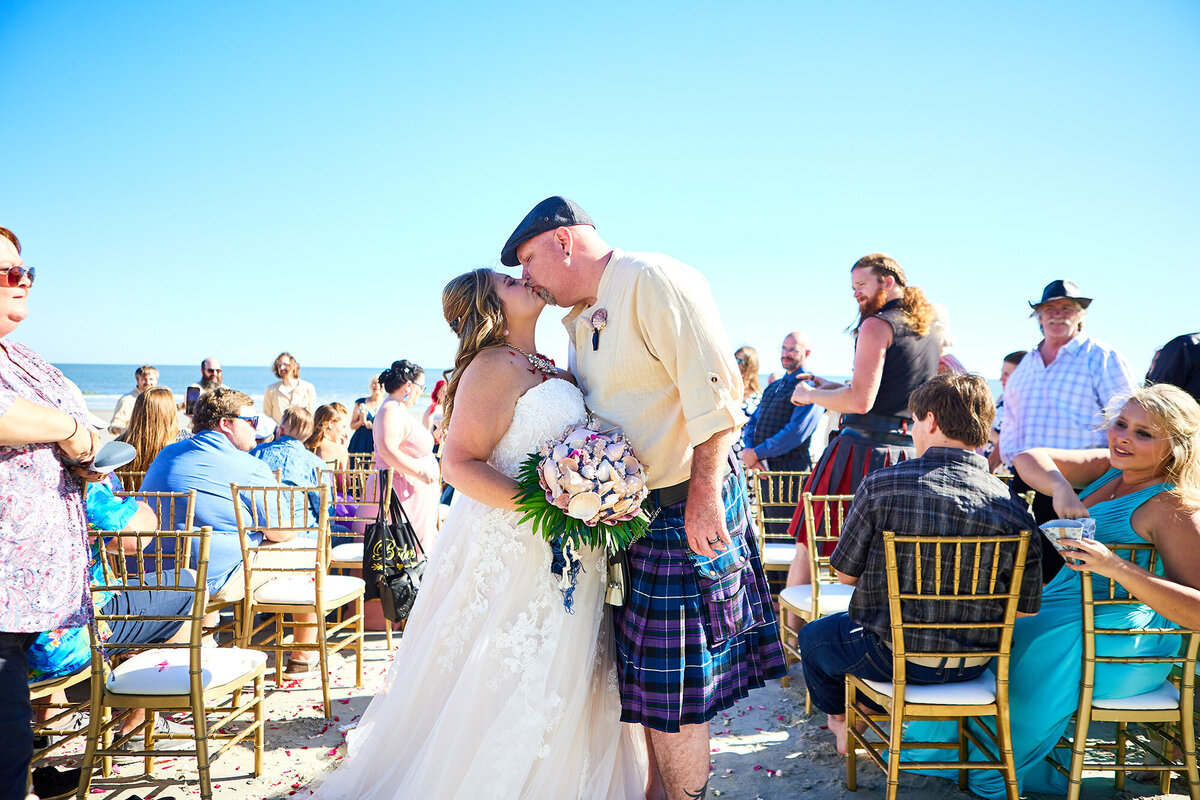 Folly Beach wedding ceremony recessional Charleston Wedding Photographer