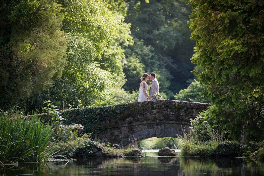 Bride and Groom on Bridge at Bovey Castle Wedding Devon