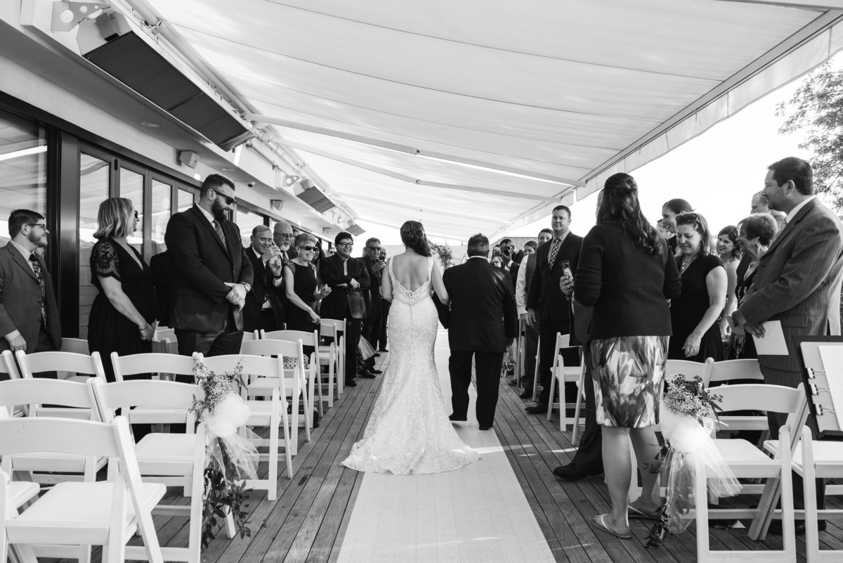 Black and white photo of a ceremony at Harbor Club at Prime