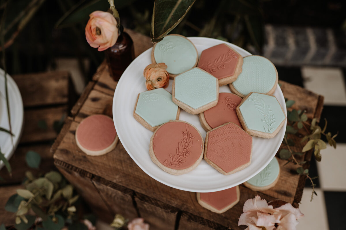 Mixed botanical inspired wedding biscuit favours dessert table