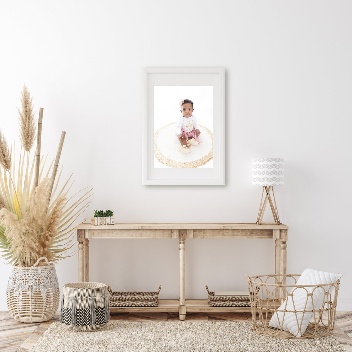 A toddler photo hangs in a fine art frame in a living room